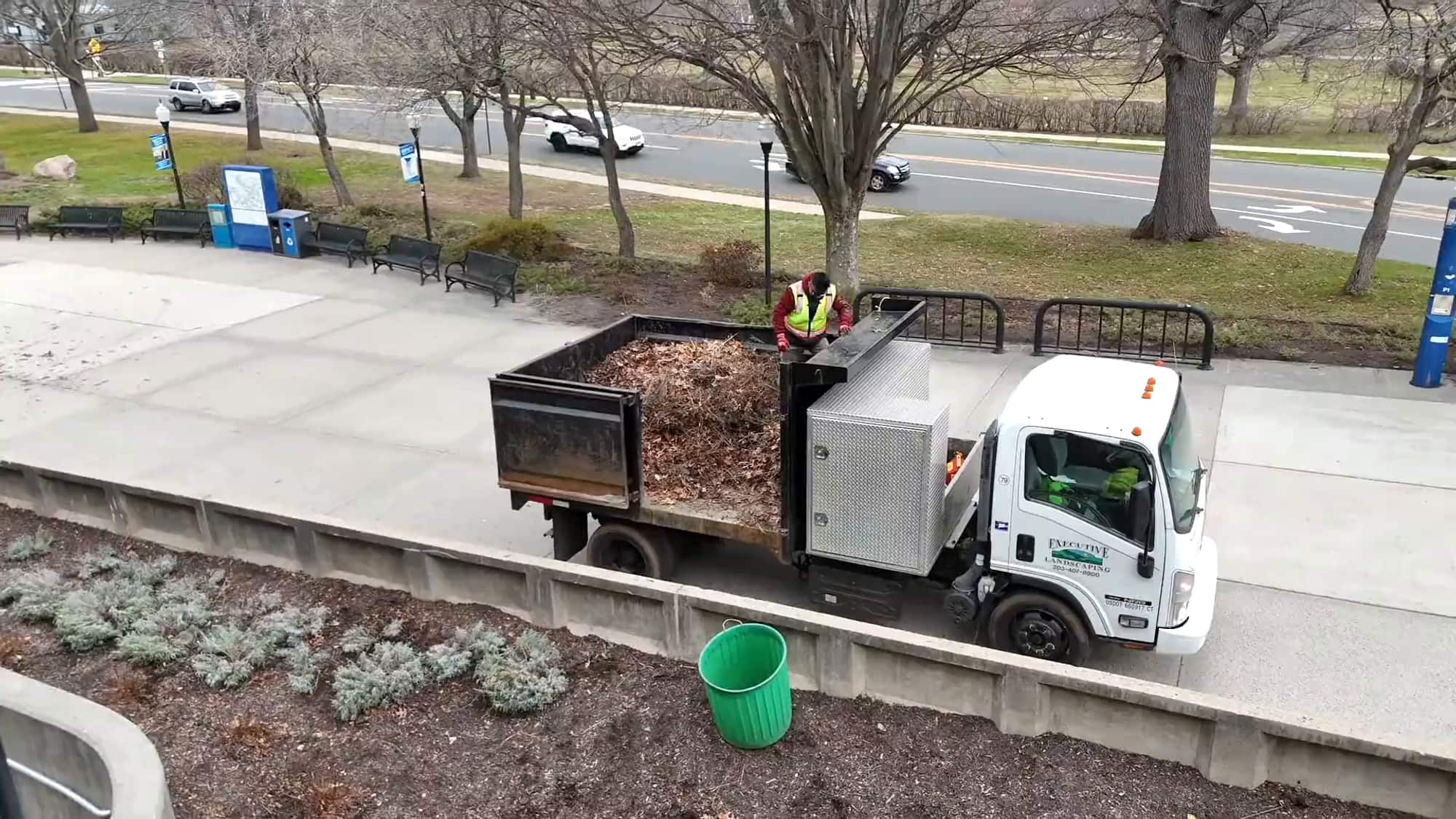 Executive Landscaping crew and truck on a commercial property cleanup in Connecticut